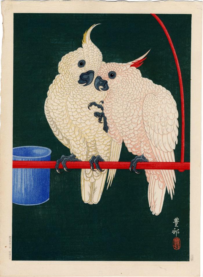 Two white cockatoos on a red perch