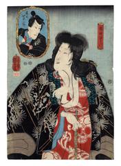 Bandō Shūka I (坂東しうか) as Kijin no Omatsu (鬼神おまつ), the Demon God, and Ichikawa Danjurō VIII (市川団十郎) as Natsume Shirōsaburō (夏目四郎三郎) holding their child - from the play <i>Shinpan Koshi no Shiranami</i> (新板越白浪 ) performed with <i>Genji moyō furisode hinagata</i> (源氏模様娘雛形)