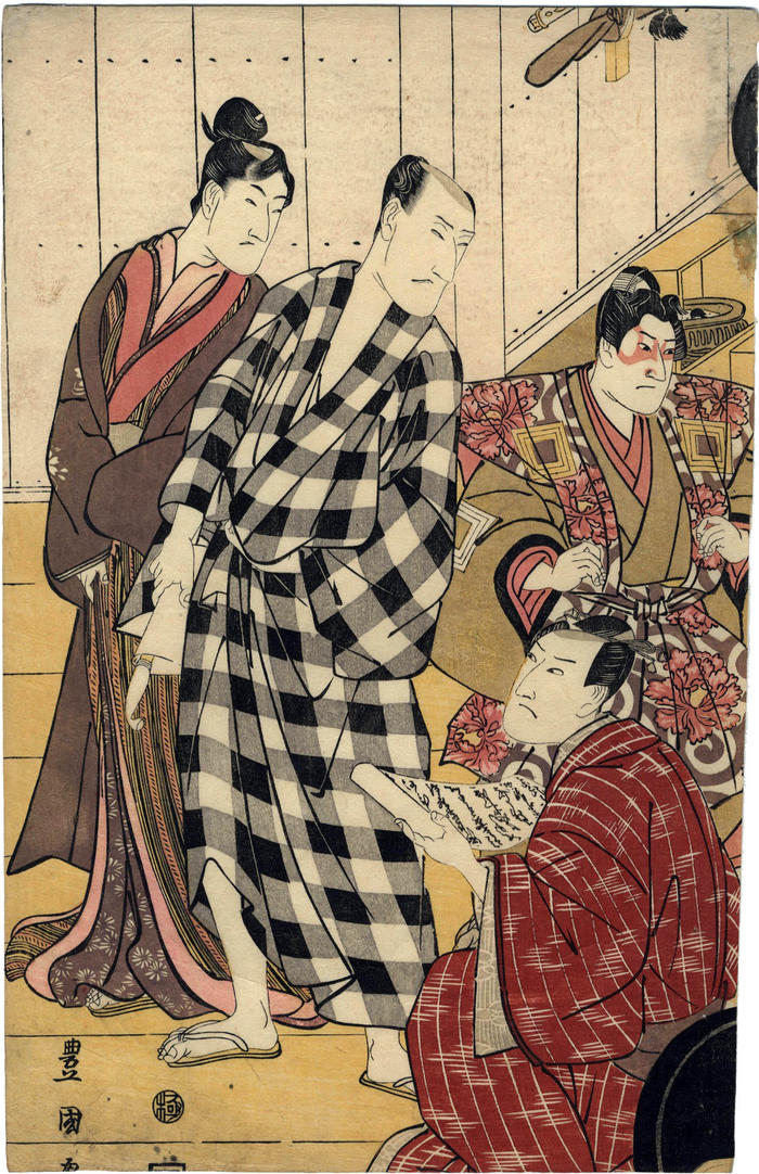 Nakayama Tomisaburō I standing next to Matsumoto Koshirō V in the checkered robe, Ichikawa Danjurō VII in makeup and Onoe Eizaburō I seated and holding a scroll - this is the left panel of a triptych entitled <i>Edo shibai sangai no zu</i> ('The 3rd Floor of an Edo Theater' - 江戸芝居三階之図)